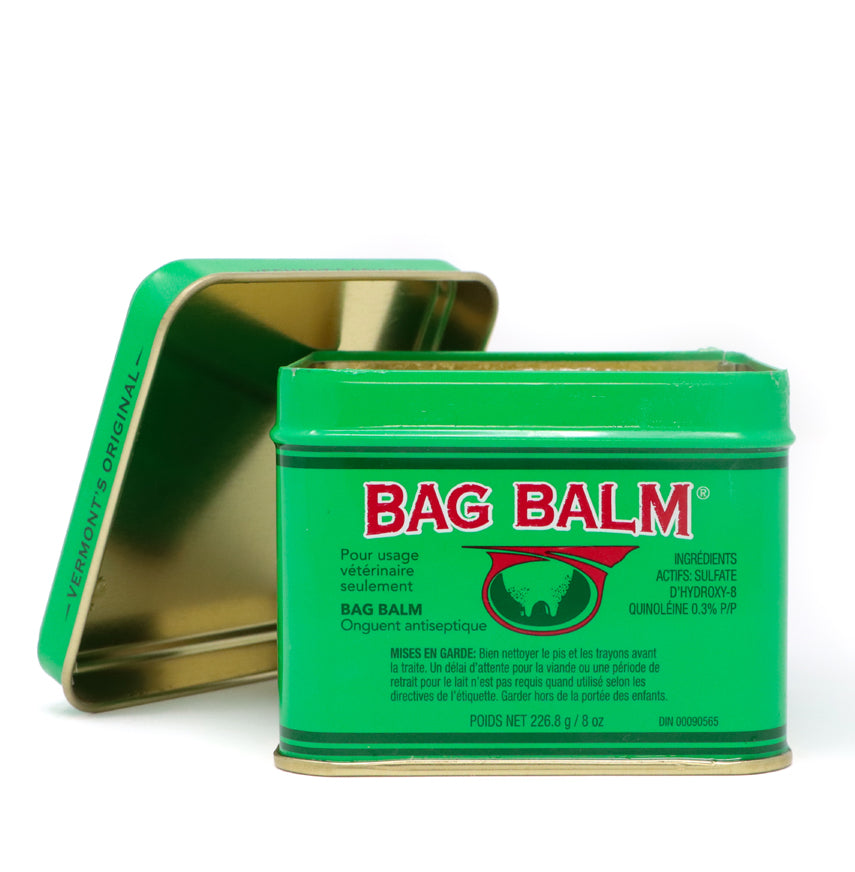 Bag Balm Antiseptic Ointment 8 oz tin. The tin features the classic green design with the Bag Balm logo on the front. The ointment is known for its moisturizing and healing properties. The tin is set against a white background.