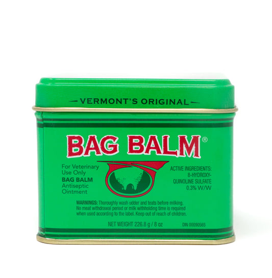 Bag Balm Antiseptic Ointment 8 oz tin. The tin features the classic green design with the Bag Balm logo on the front. The ointment is known for its moisturizing and healing properties. The tin is set against a white background.